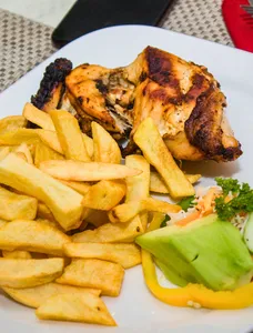 Grilled Chicken Leg, Chips, and Salad