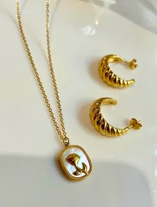 Croissant Earrings and Floral Necklace